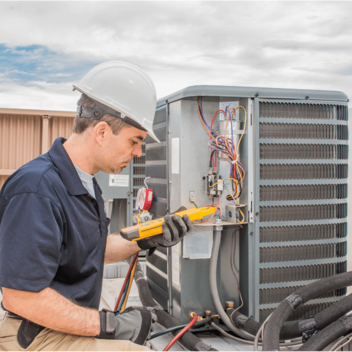 St. Thomas HVAC Pros HVAC technician servicing a system