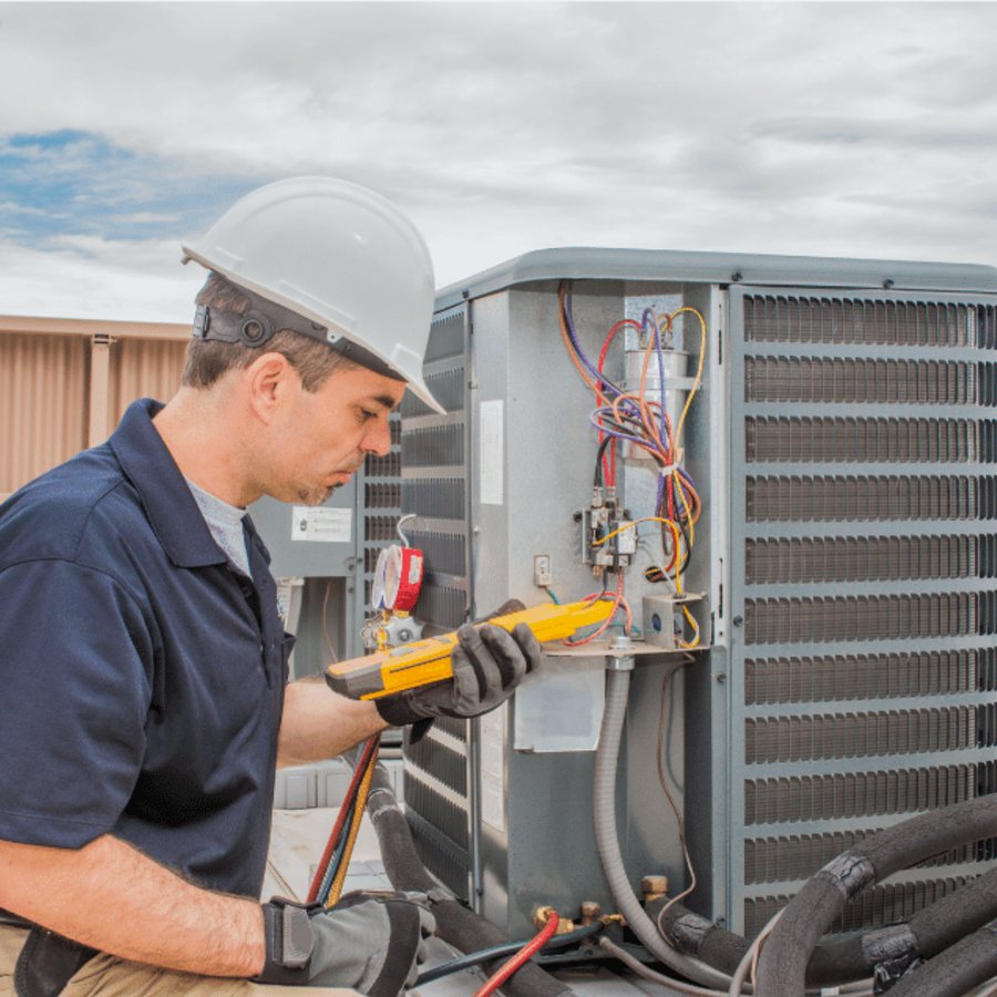 St. Thomas HVAC Pros HVAC technician servicing a system