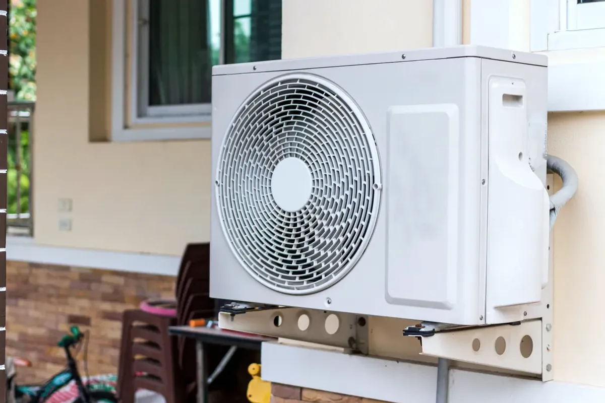 Outdoor heat pump unit on a wall bracket